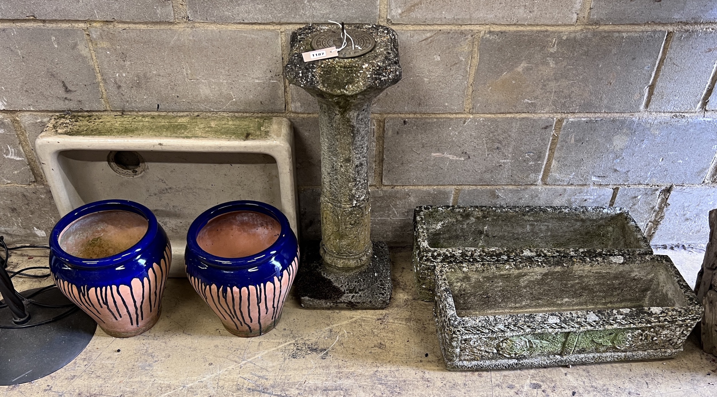 A pair of reconstituted stone garden planters, a sun dial, pair of terracotta pots and a sink